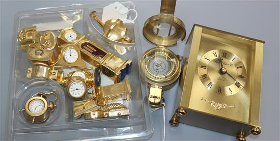 A collection of twelve novelty miniature brass clocks, a modern brass compass by Ross and a quartz gilt brass carriage clock